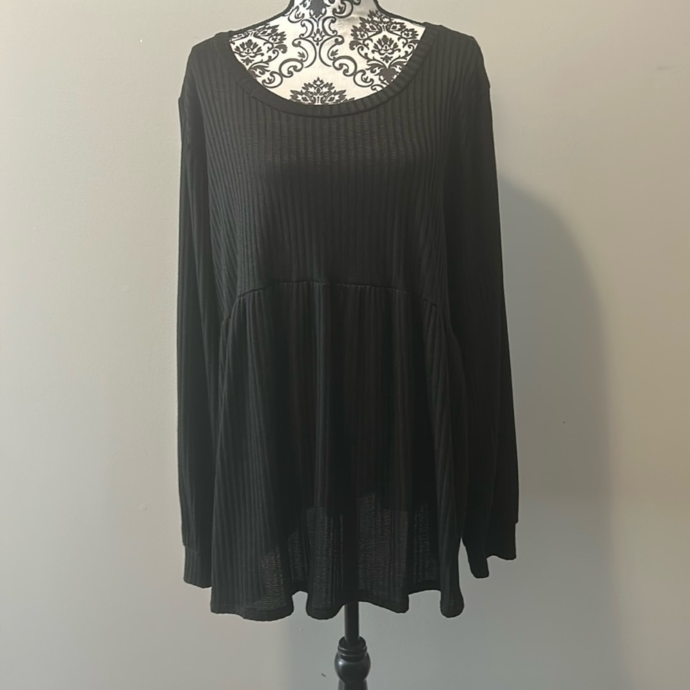 NWOT.  Woman’s round neck babydoll style long sleeve t-shirt in solid black.